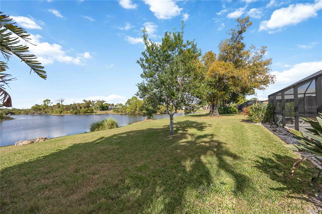 222 Sportsman Road Rotonda West, FL 33947 - Photo 39 of 54 a view of yard with green space