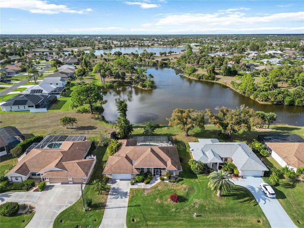 222 Sportsman Road Rotonda West, FL 33947 - Photo 4 of 54 an aerial view of residential houses with outdoor space