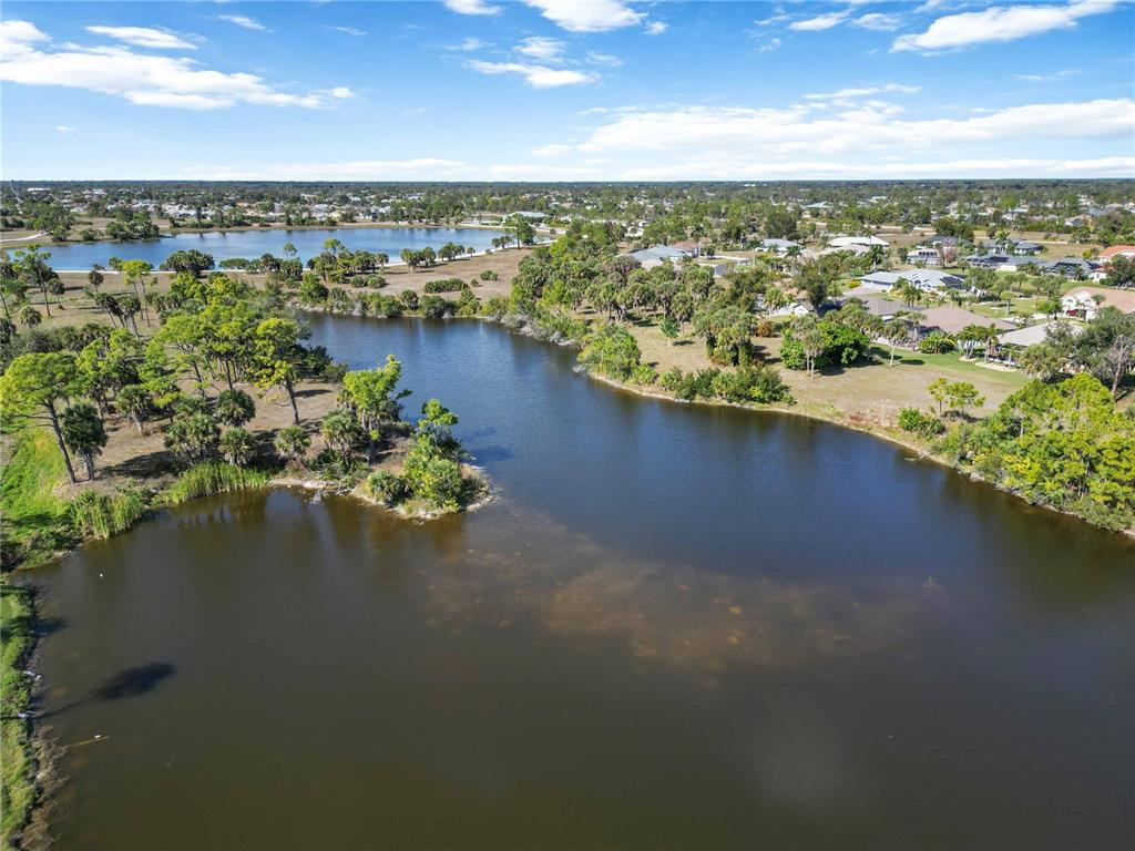 222 Sportsman Road Rotonda West, FL 33947 - Photo 48 of 54 an aerial view of ocean and residential houses with outdoor space