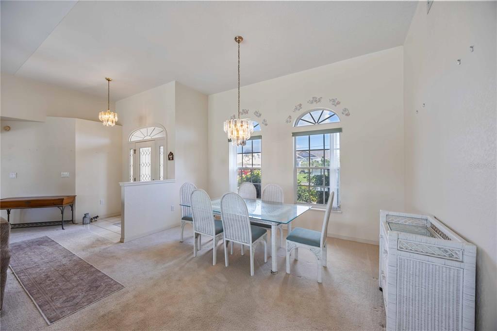 222 Sportsman Road Rotonda West, FL 33947 - Photo 6 of 54 a view of a dining room with furniture