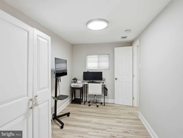 a workspace with furniture and a window