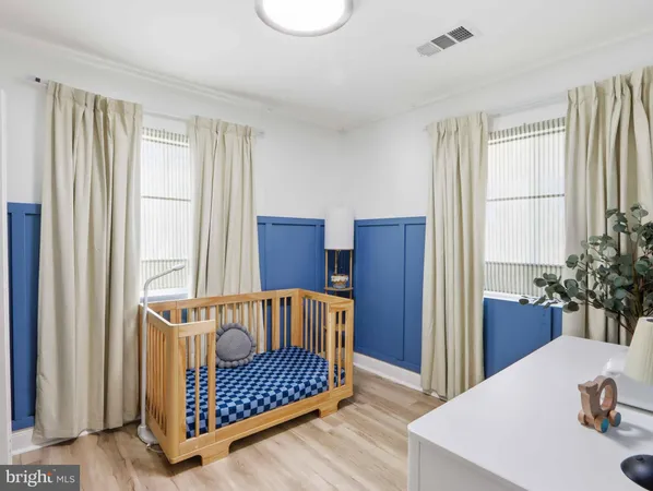 a bedroom with furniture and window