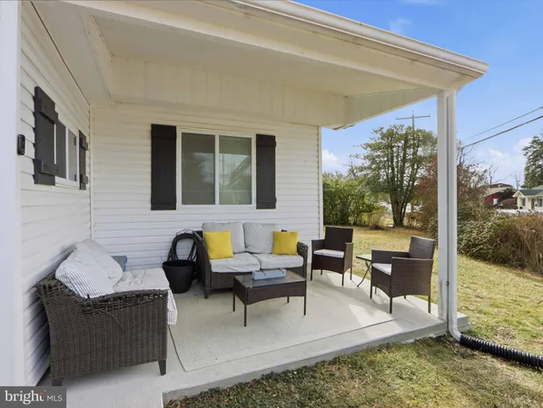 a outdoor space with patio the couches and a dining table with the ocean view