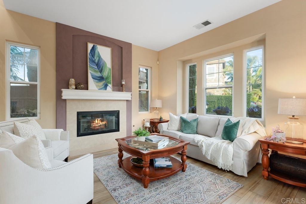 979 Canyon Heights San Marcos, CA 92078 - Photo 12 of 58 a living room with furniture and a fireplace