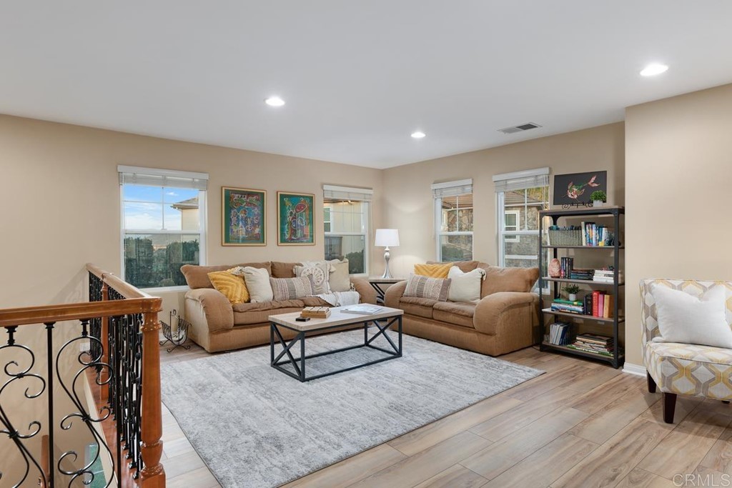 979 Canyon Heights San Marcos, CA 92078 - Photo 25 of 58 a living room with furniture and a wooden floor