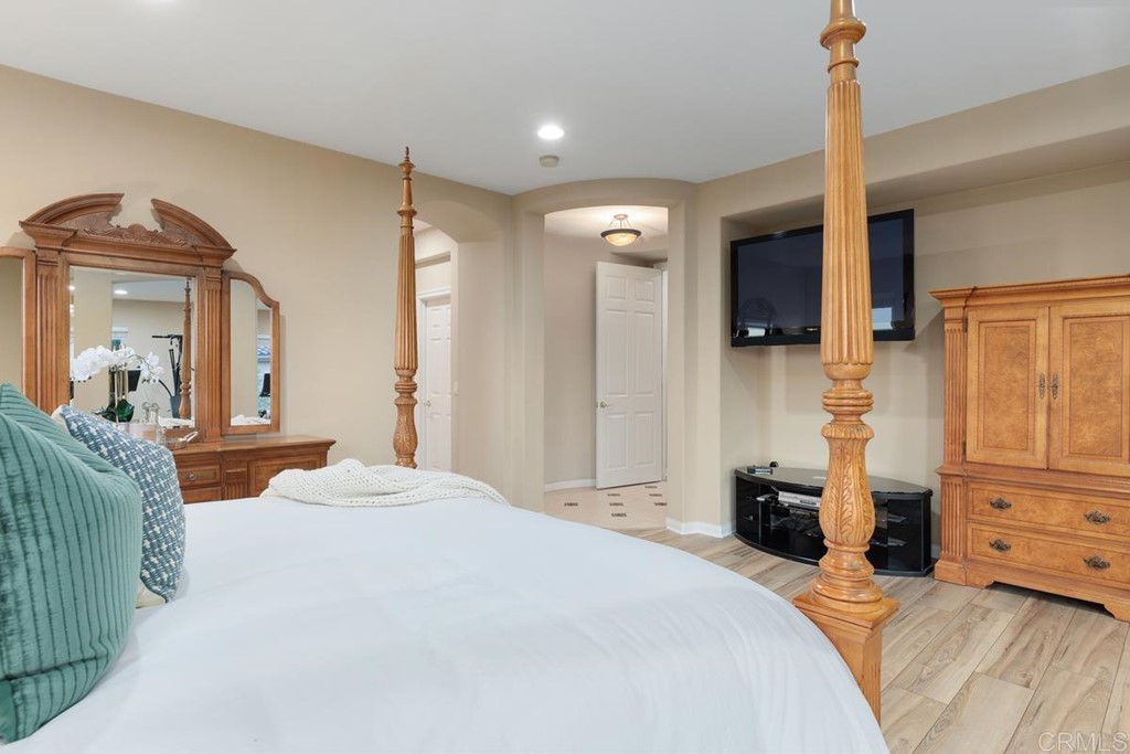979 Canyon Heights San Marcos, CA 92078 - Photo 30 of 58 a bedroom with a bed and a mirror