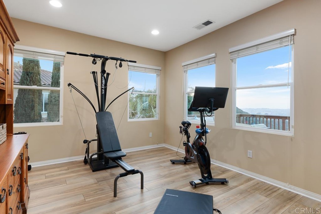979 Canyon Heights San Marcos, CA 92078 - Photo 31 of 58 a view of a room with gym equipment and windows
