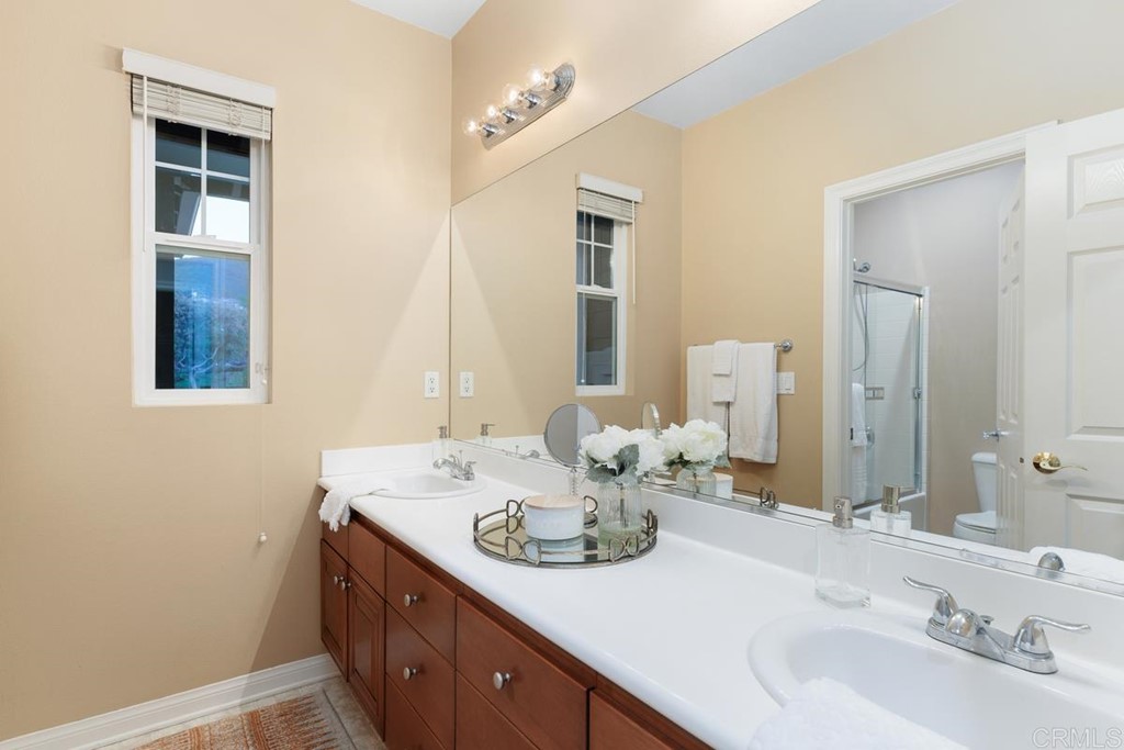 979 Canyon Heights San Marcos, CA 92078 - Photo 36 of 58 a bathroom with a sink and a mirror