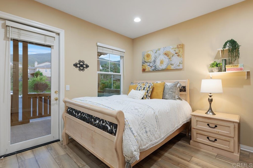 979 Canyon Heights San Marcos, CA 92078 - Photo 37 of 58 a bedroom with a bed and a window