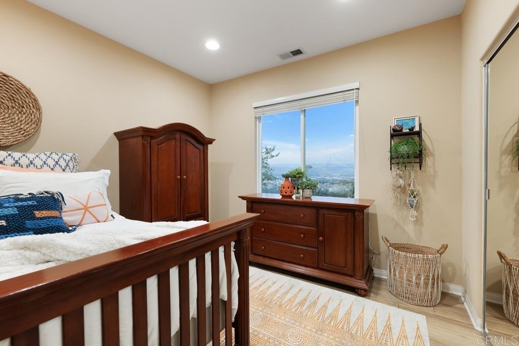 979 Canyon Heights San Marcos, CA 92078 - Photo 38 of 58 a bedroom with a bed and a dresser