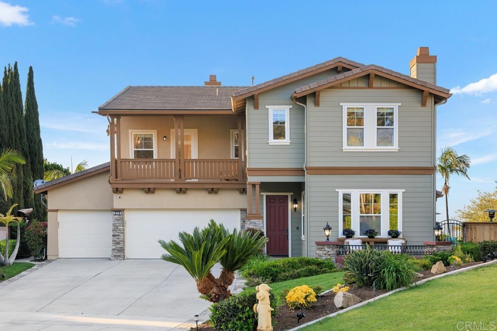 979 Canyon Heights San Marcos, CA 92078 - Photo 7 of 58 a front view of a house with a yard