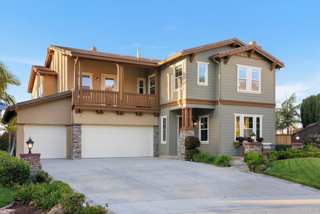 979 Canyon Heights San Marcos, CA 92078 - Photo 8 of 58 a front view of a house with a yard and garage
