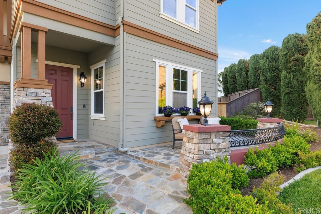 979 Canyon Heights San Marcos, CA 92078 - Photo 9 of 58 front view of a house with a chairs and table in a patio