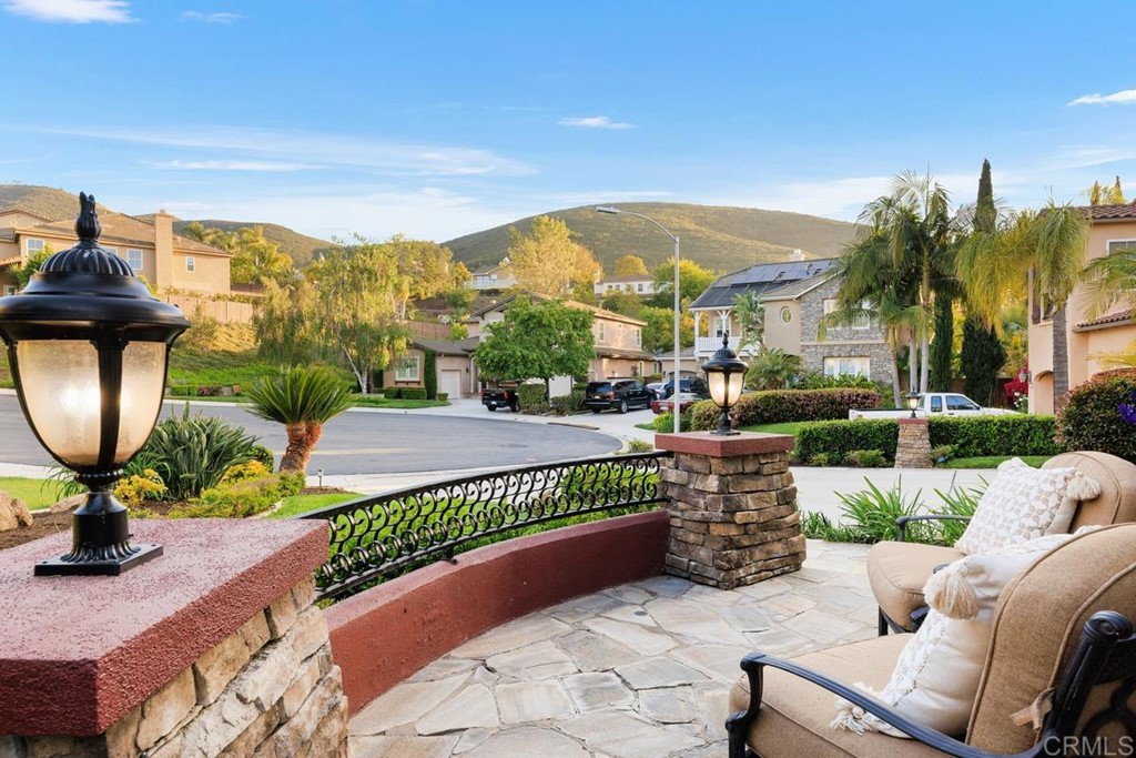 979 Canyon Heights San Marcos, CA 92078 - Photo 10 of 58 a view of a patio with couches table and chairs and potted plants