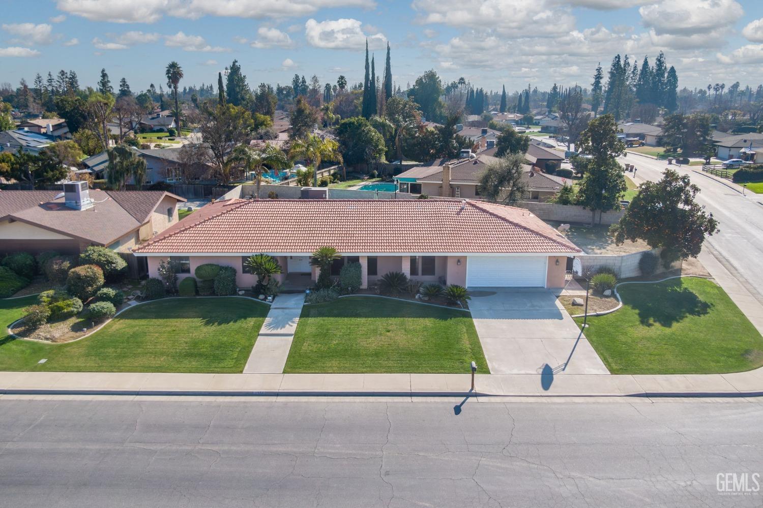 Undisclosed Address Bakersfield, CA 93309 - Photo 2 of 59 a view of a terrace with a garden