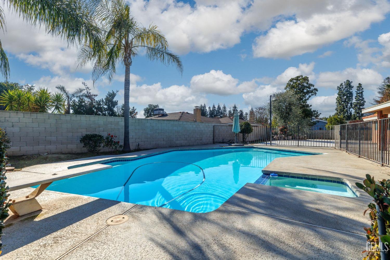 Undisclosed Address Bakersfield, CA 93309 - Photo 54 of 59 a view of a swimming pool with a patio