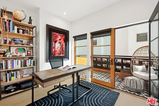 a view of balcony with wooden floor