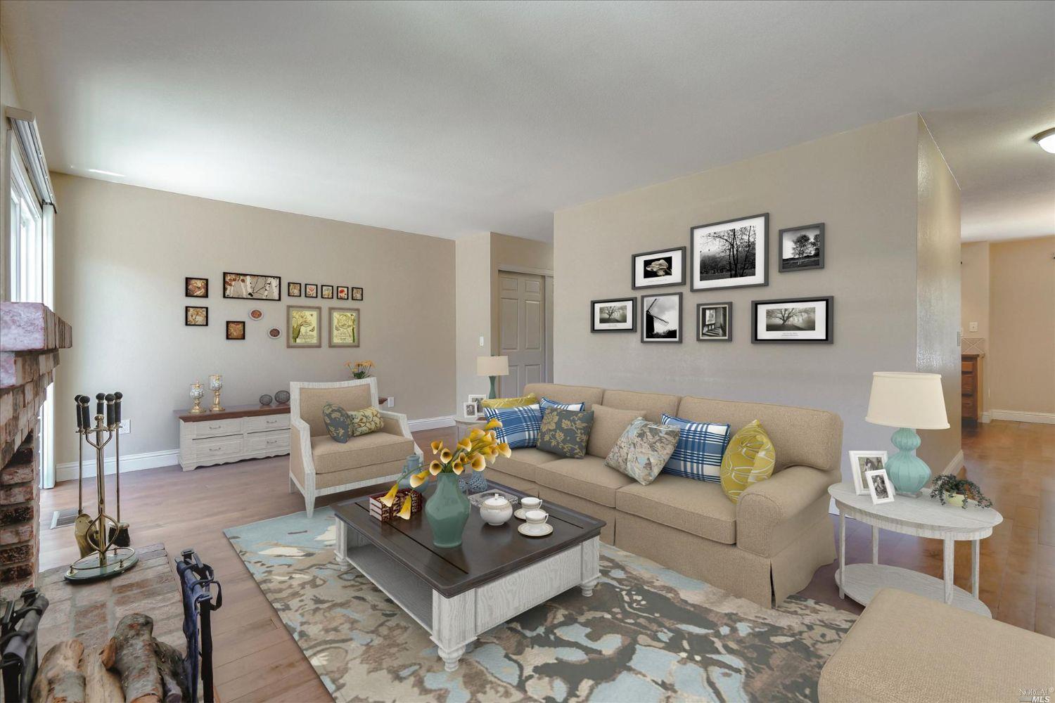 a living room with furniture and paintings on the wall