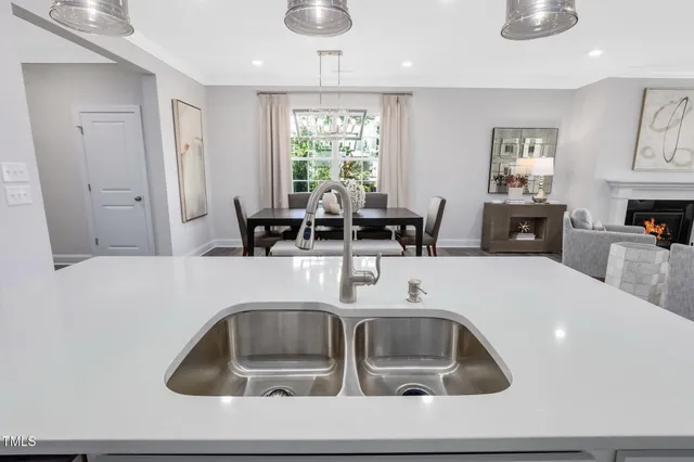 a kitchen with a sink cabinets and window