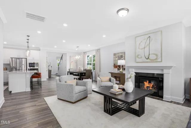 a living room with furniture fireplace and window