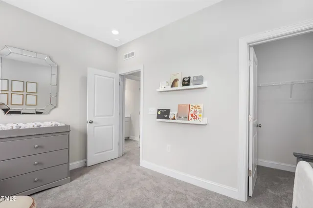 a room with a cabinets and painting on the wall