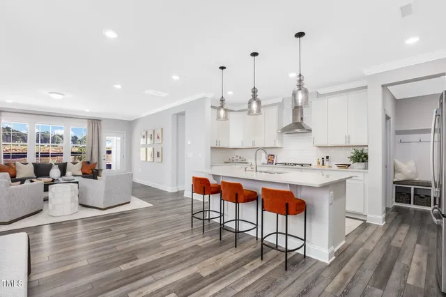 a large kitchen with lots of counter space and stainless steel appliances