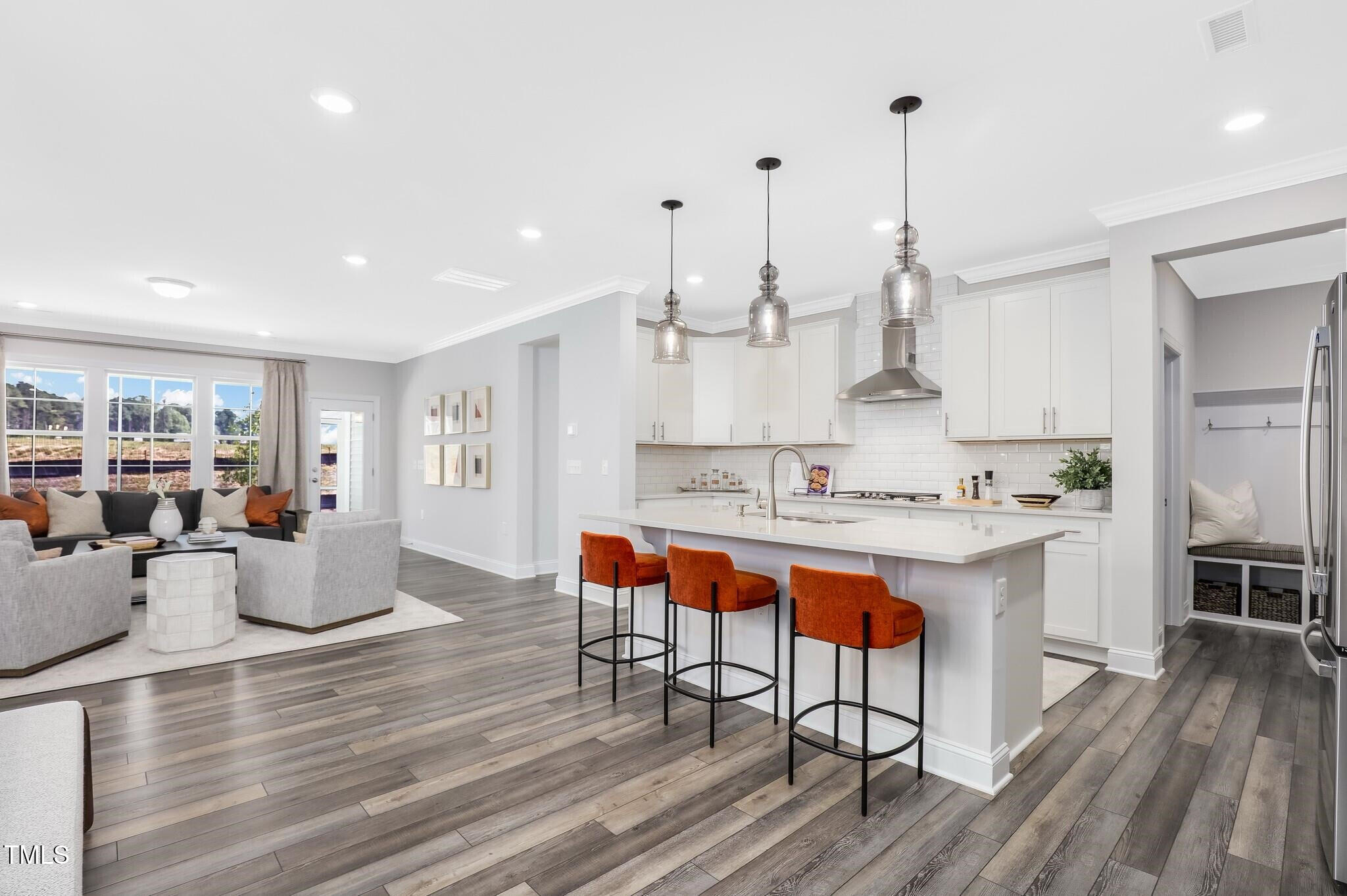 329 Calvander Lane Apex, NC 27539 - Photo 5 of 47 a large kitchen with lots of counter space and stainless steel appliances