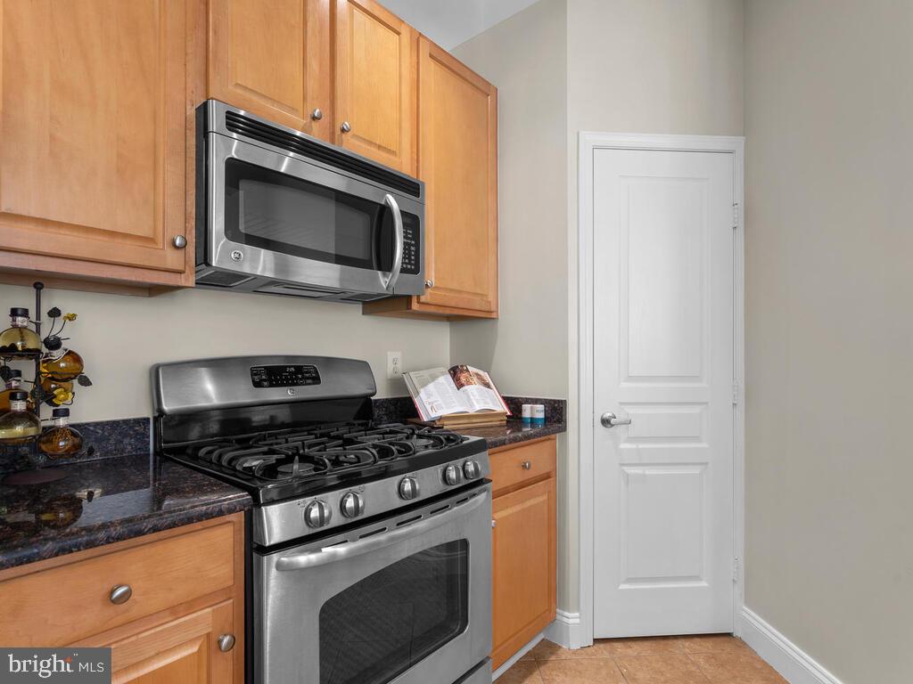 12001 Market Street, Unit 172 Reston, VA 20190 - Photo 13 of 39 Kitchen pantry! These are rare in this building.