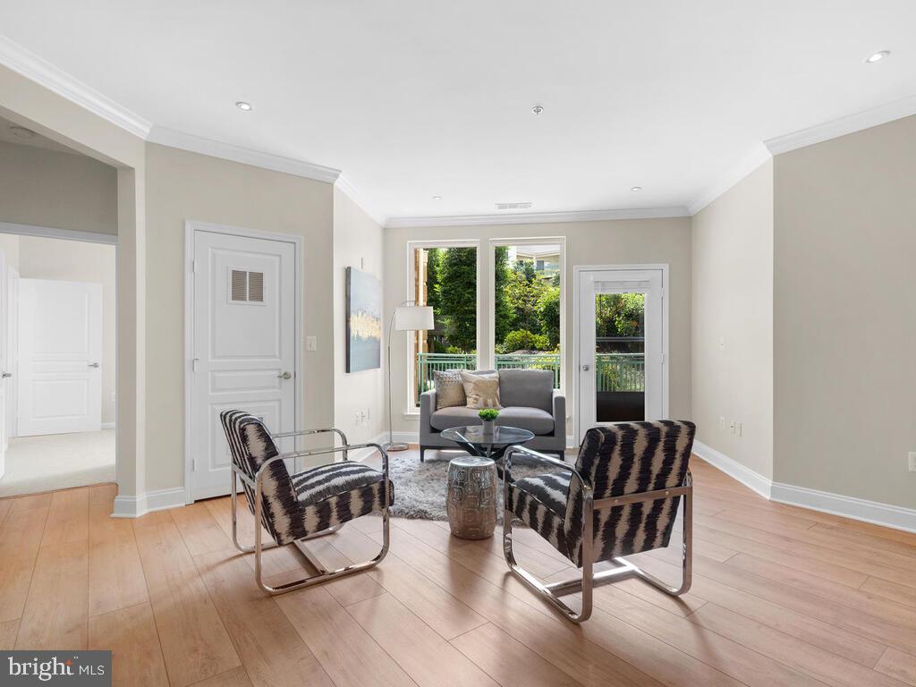 12001 Market Street, Unit 172 Reston, VA 20190 - Photo 3 of 39 Living room overlooks the oversized patio