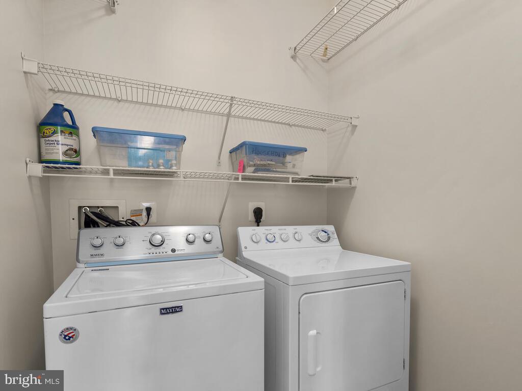12001 Market Street, Unit 172 Reston, VA 20190 - Photo 21 of 39 Large laundry room with storage space.