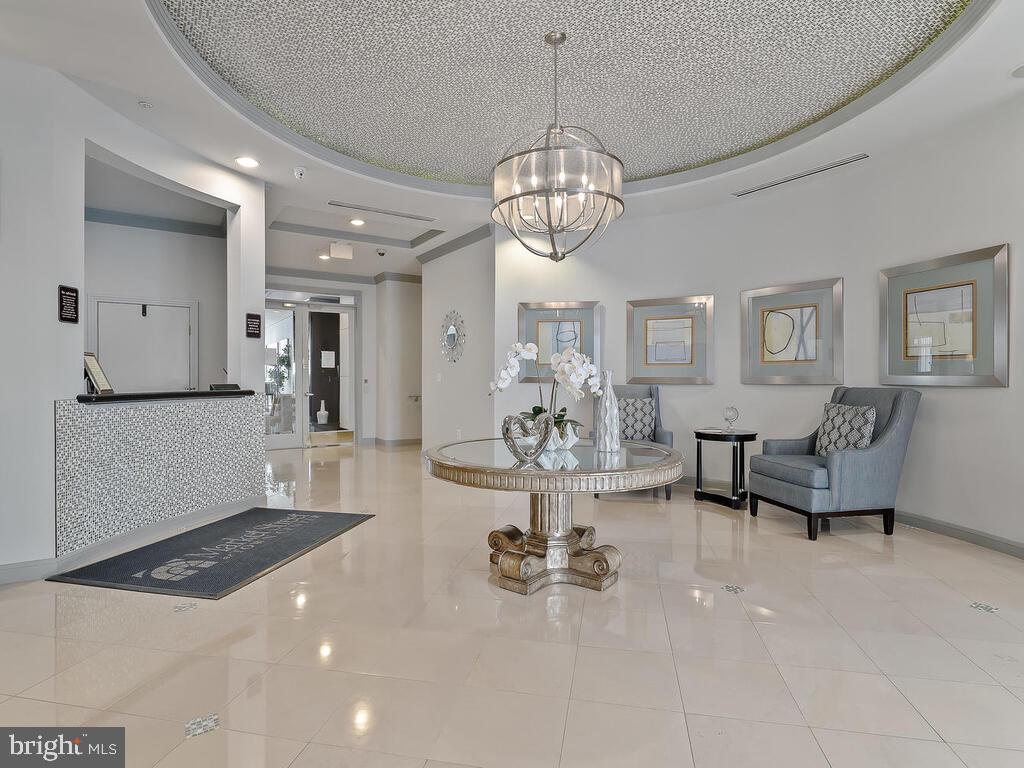12001 Market Street, Unit 172 Reston, VA 20190 - Photo 24 of 39 Lobby and concierge desk
