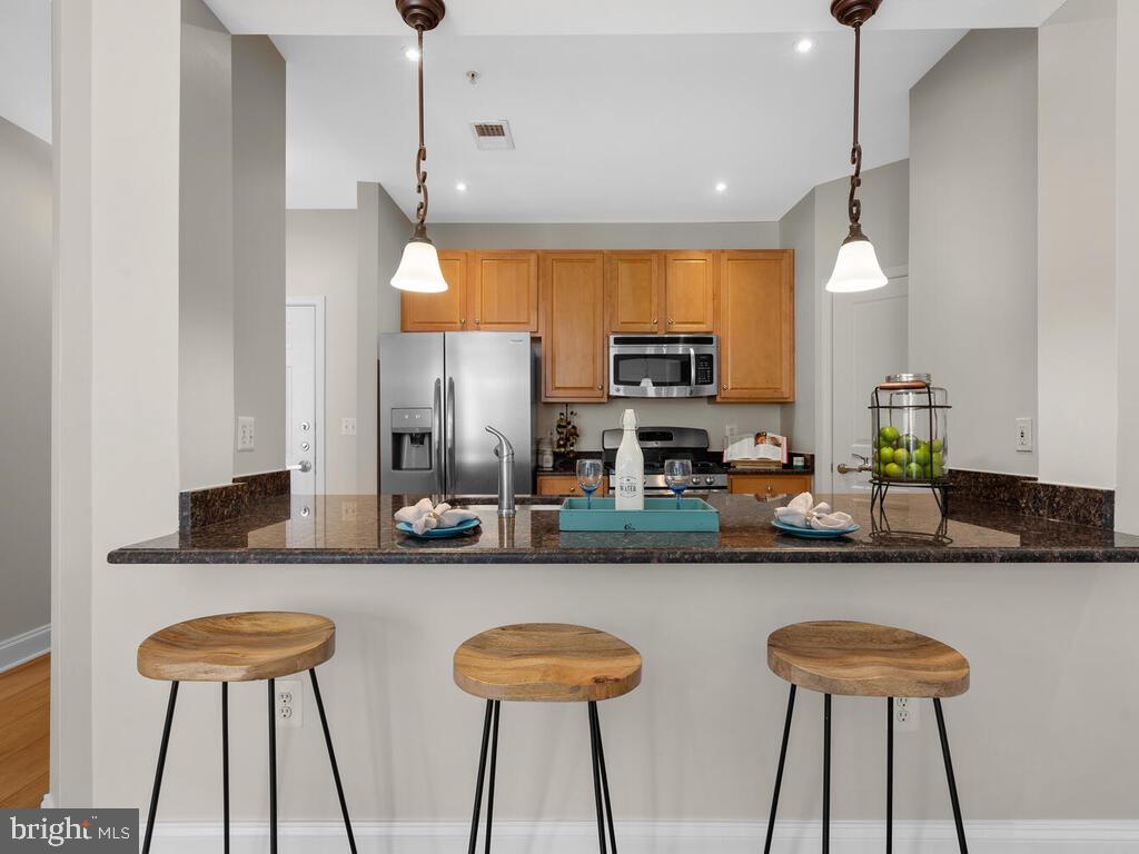 12001 Market Street, Unit 172 Reston, VA 20190 - Photo 7 of 39 Huge counter height island
