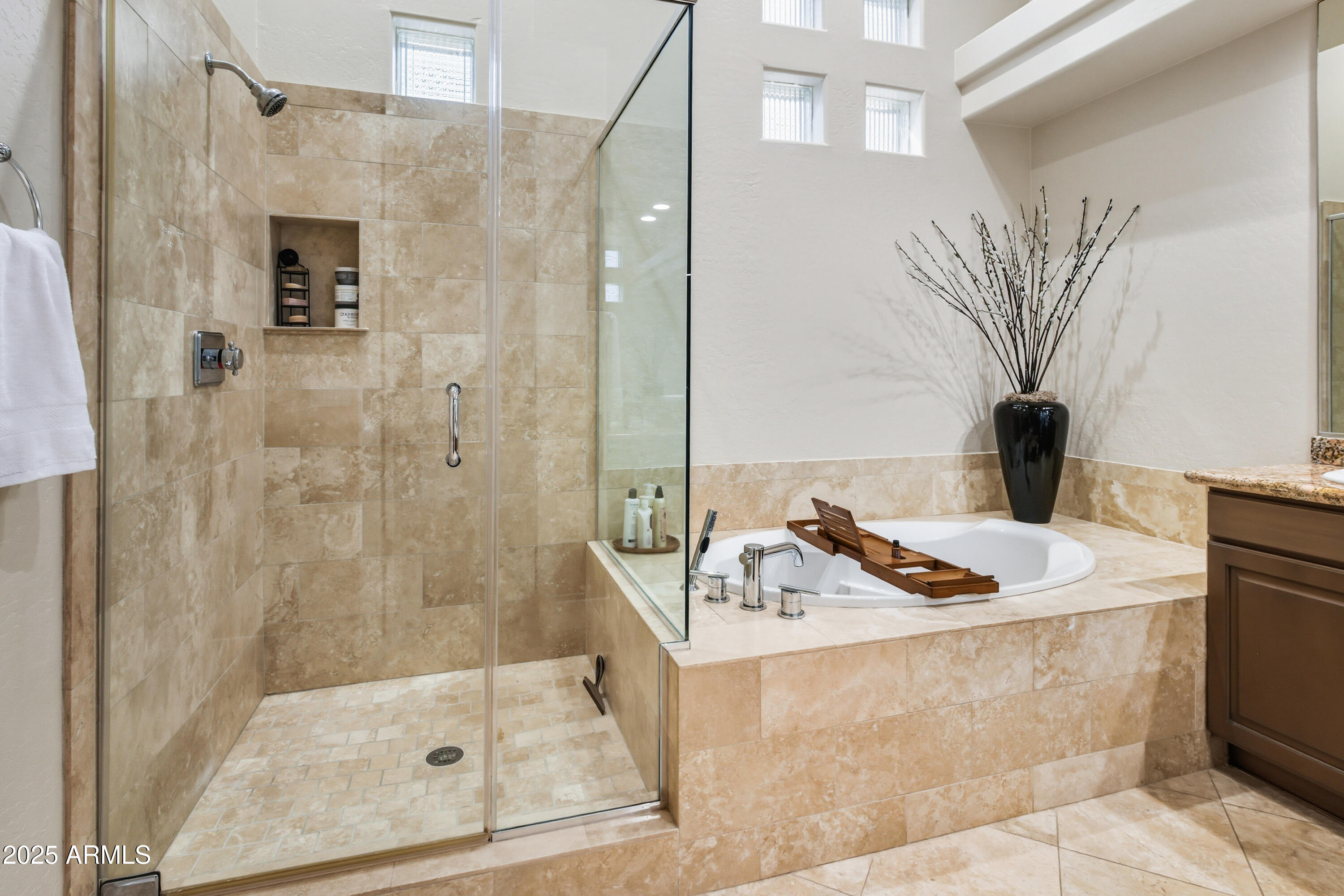 10637 East Blanche Drive Scottsdale, AZ 85255 - Photo 30 of 36 a bathroom with a sink a mirror and a shower