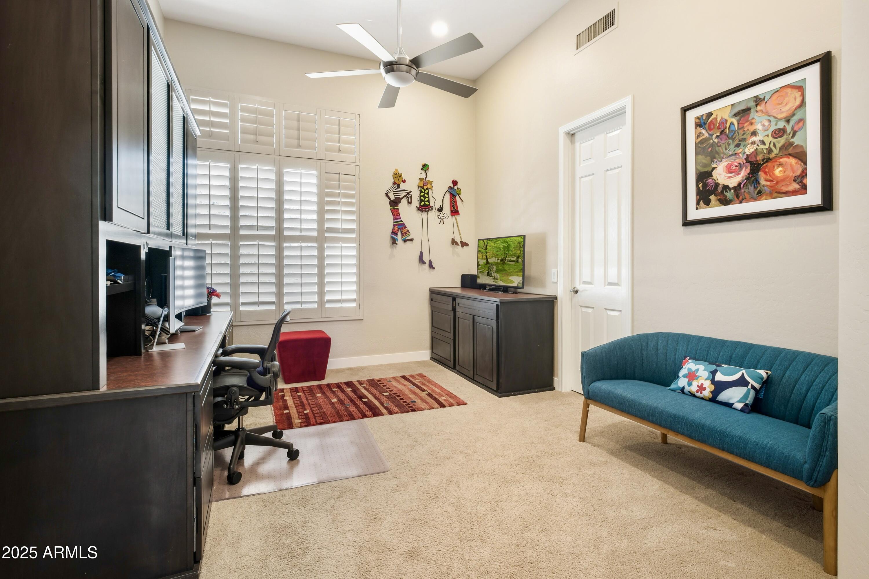 10637 East Blanche Drive Scottsdale, AZ 85255 - Photo 35 of 36 a living room with furniture and a window