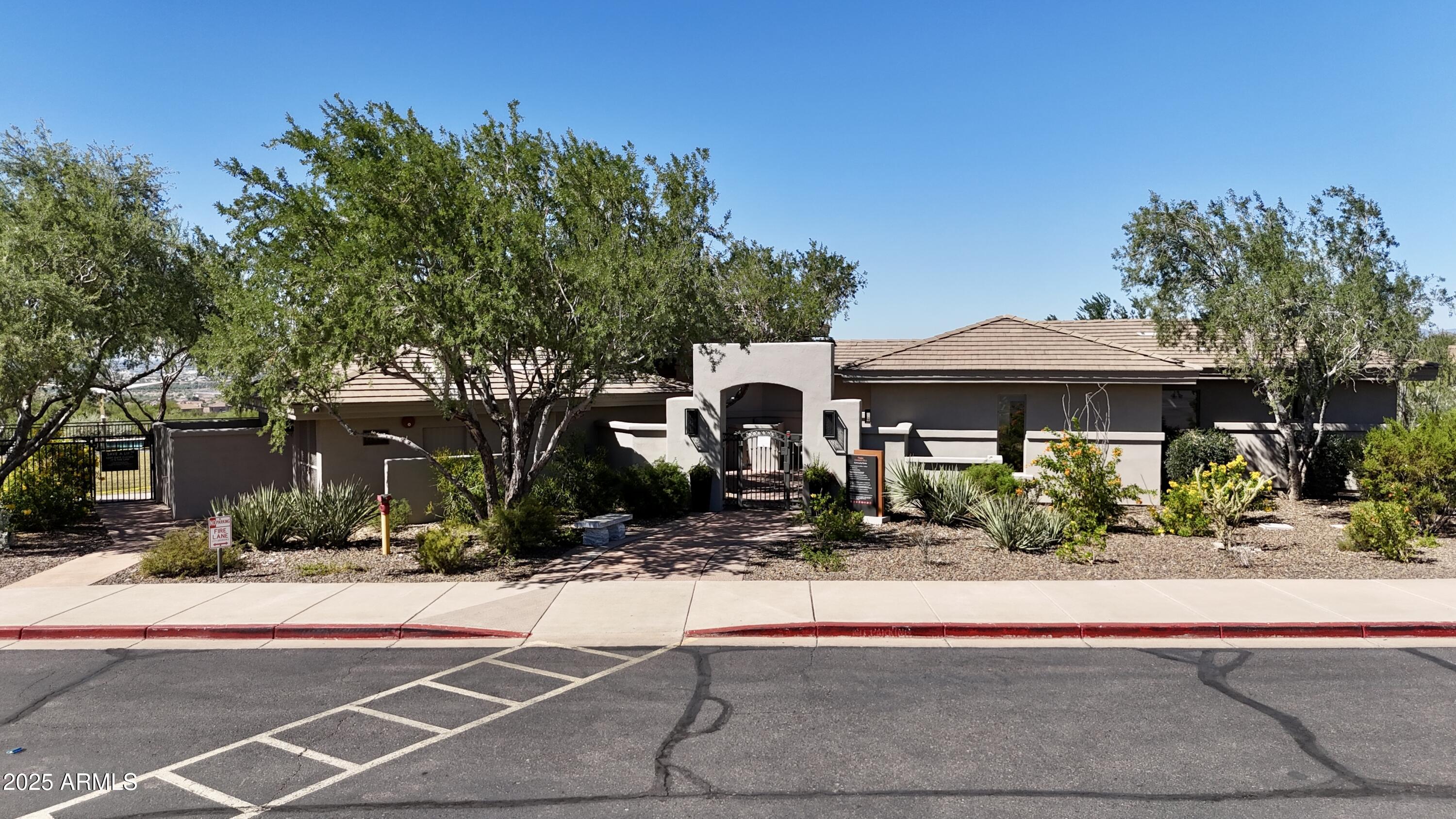 10637 East Blanche Drive Scottsdale, AZ 85255 - Photo 6 of 36 a front view of a house with a yard