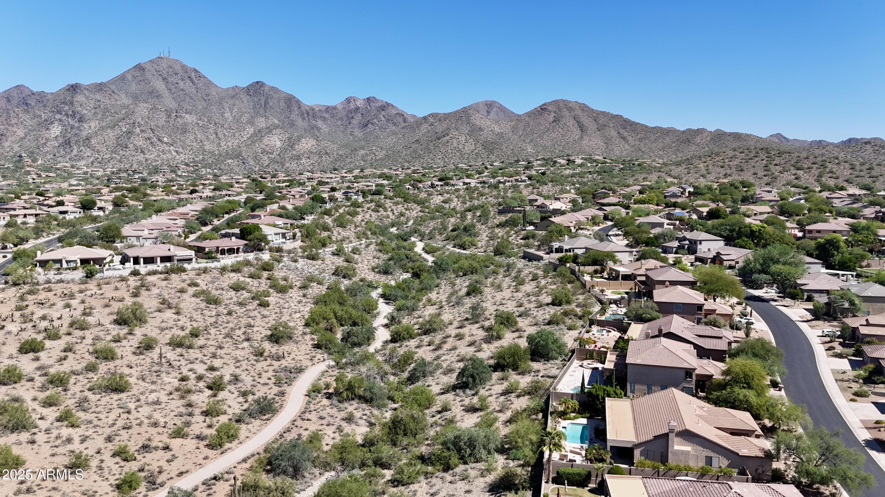 10637 East Blanche Drive Scottsdale, AZ 85255 - Photo 10 of 36 an aerial view of residential house and sandy dunes