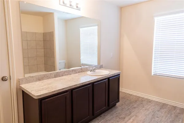 a kitchen with a sink and a window