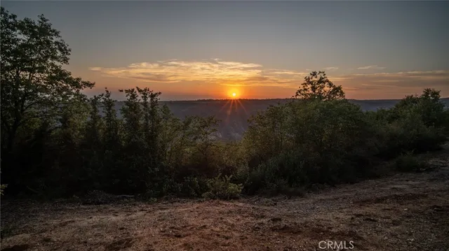 a view of an ocean and a yard