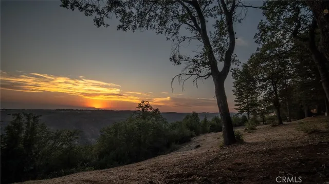 a view of a yard with a mountain