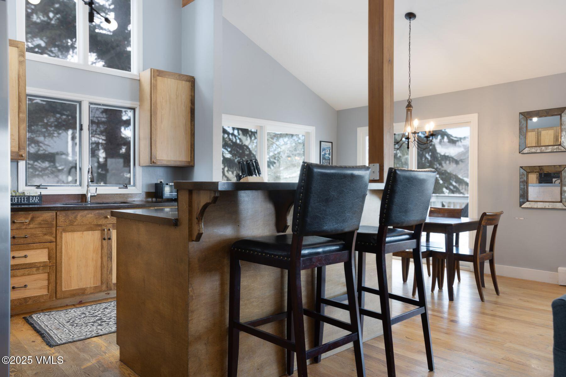 1289 Deer Boulevard, Unit A Eagle-Vail, CO 81620 - Photo 14 of 47 a view of a dining room with furniture and wooden floor