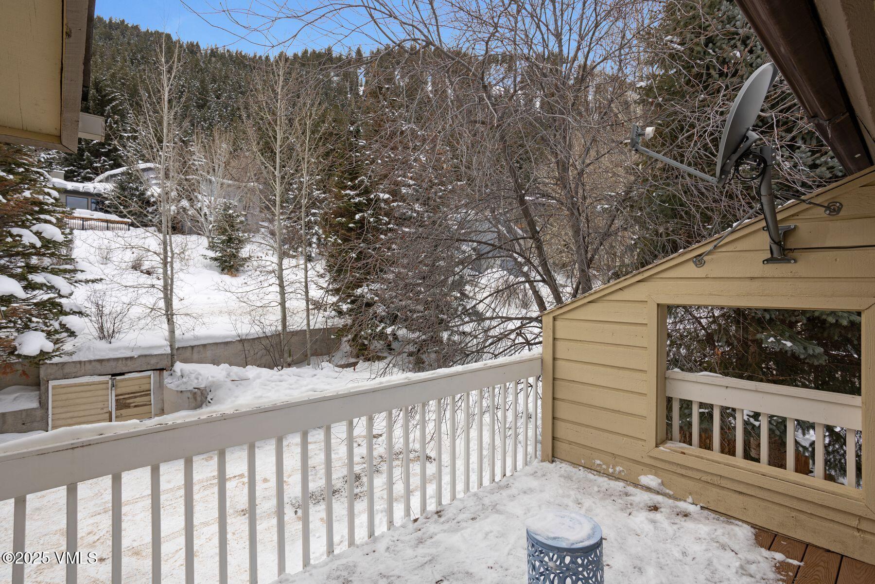 1289 Deer Boulevard, Unit A Eagle-Vail, CO 81620 - Photo 21 of 47 a view of a house with a small yard