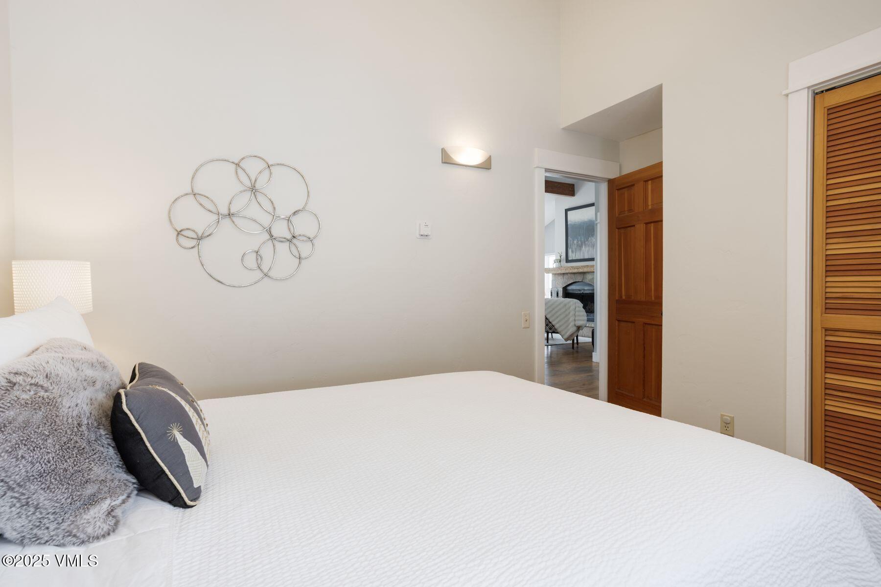 1289 Deer Boulevard, Unit A Eagle-Vail, CO 81620 - Photo 25 of 47 a bedroom with a bed and cabinets