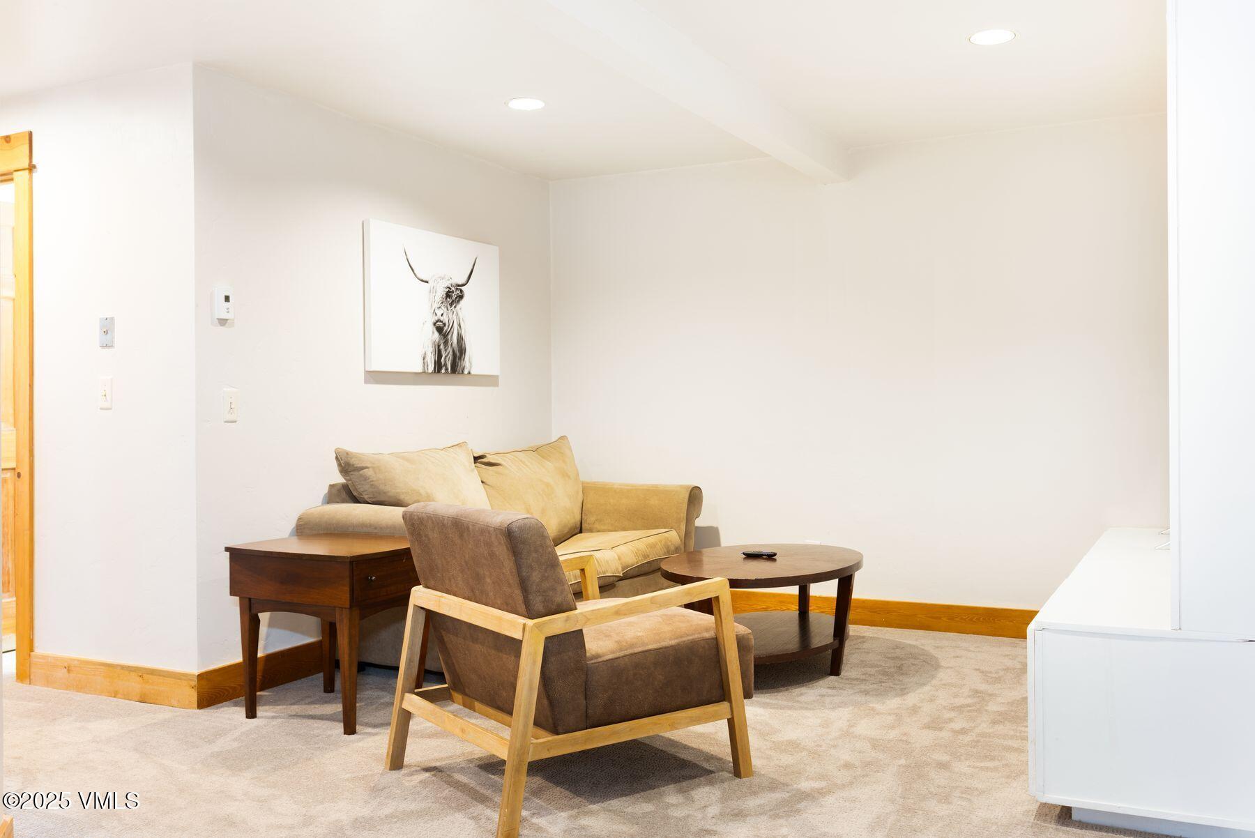 1289 Deer Boulevard, Unit A Eagle-Vail, CO 81620 - Photo 26 of 47 a living room with furniture and a table