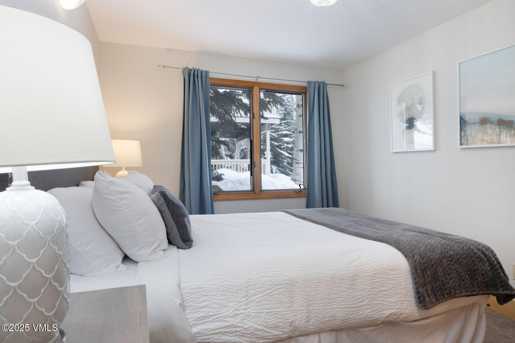 1289 Deer Boulevard, Unit A Eagle-Vail, CO 81620 - Photo 34 of 47 a bedroom with a bed and window