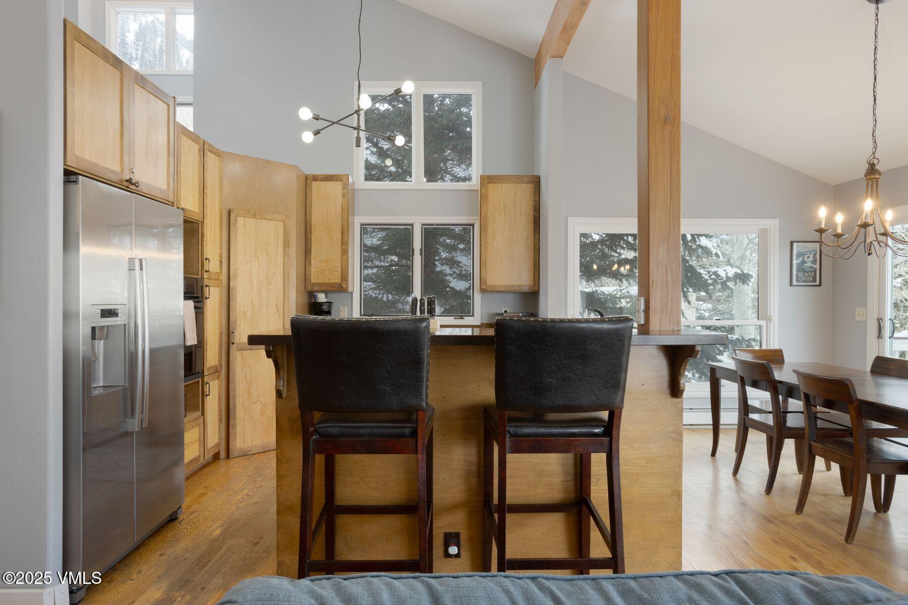 1289 Deer Boulevard, Unit A Eagle-Vail, CO 81620 - Photo 6 of 47 a view of a dining room with furniture and chandelier