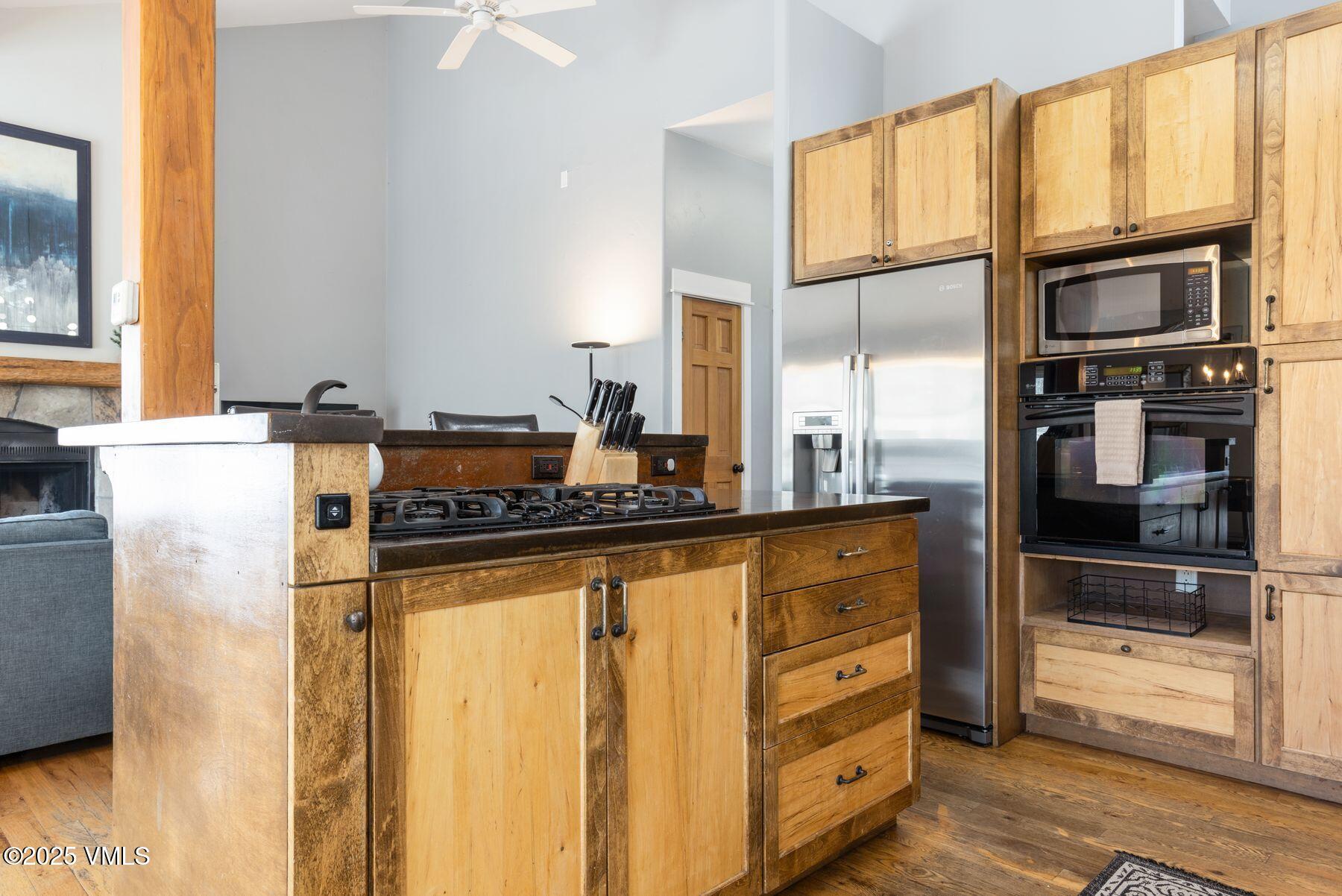 1289 Deer Boulevard, Unit A Eagle-Vail, CO 81620 - Photo 9 of 47 a kitchen with stainless steel appliances granite countertop a refrigerator and a stove