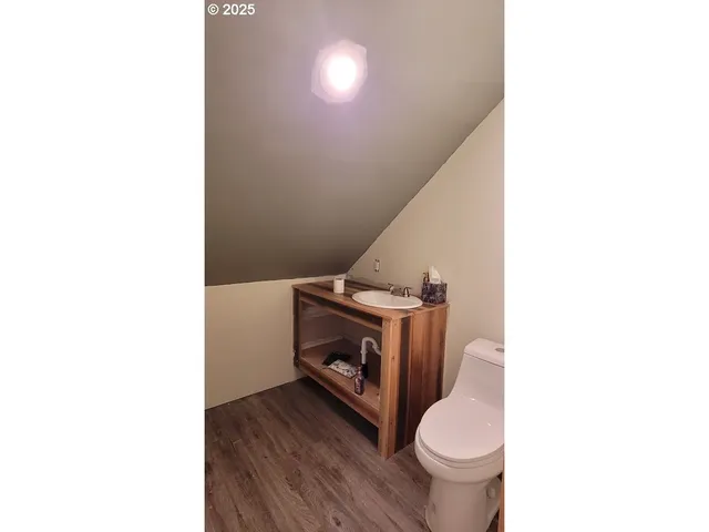 a bathroom with a toilet and a sink