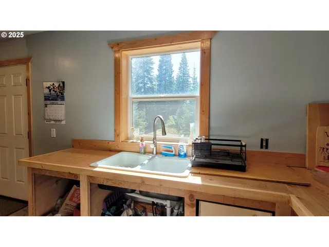a kitchen with a table and chairs in it