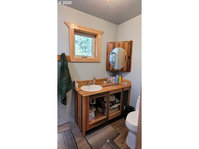 a room with a sink and a mirror