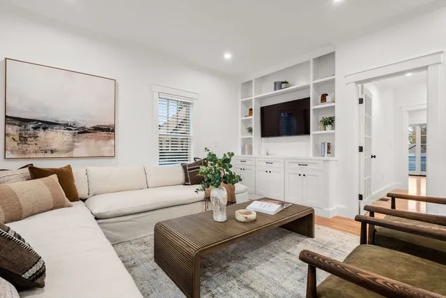 a kitchen with a white stove top oven sink and cabinets